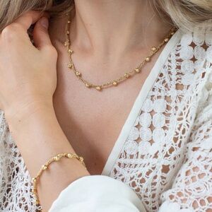 Assya London’s gold woven disco bracelet